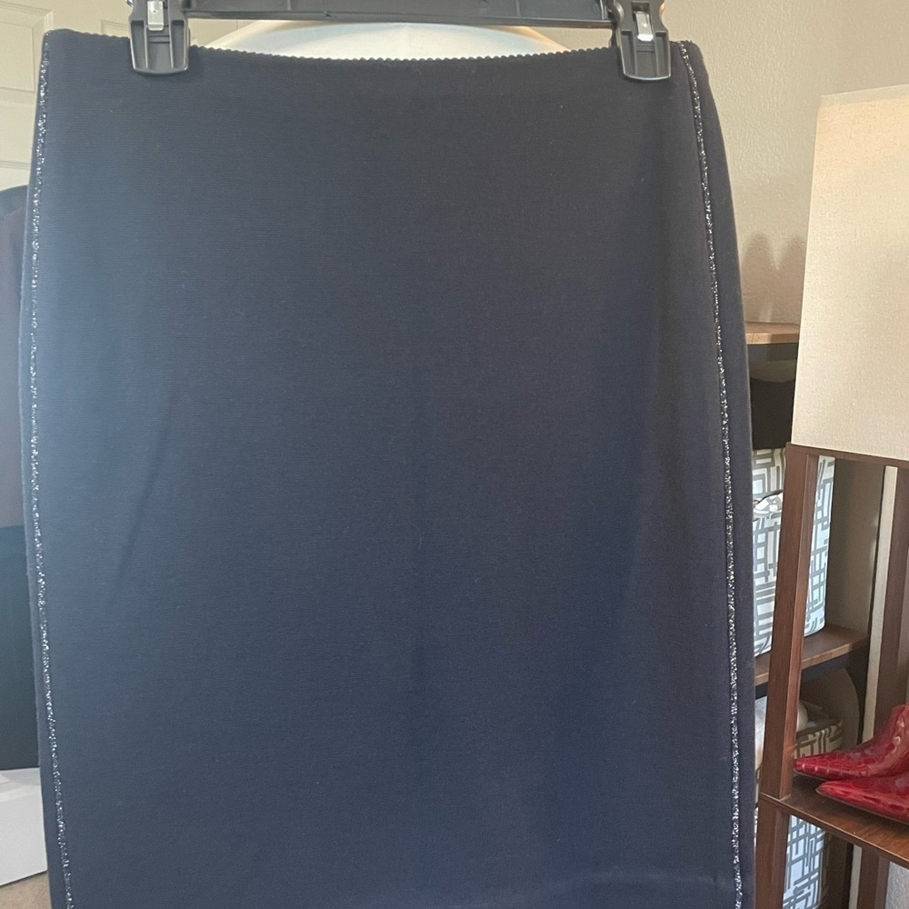 Marc‎ Cain knit black knee length skirt with metallic silver side seams.